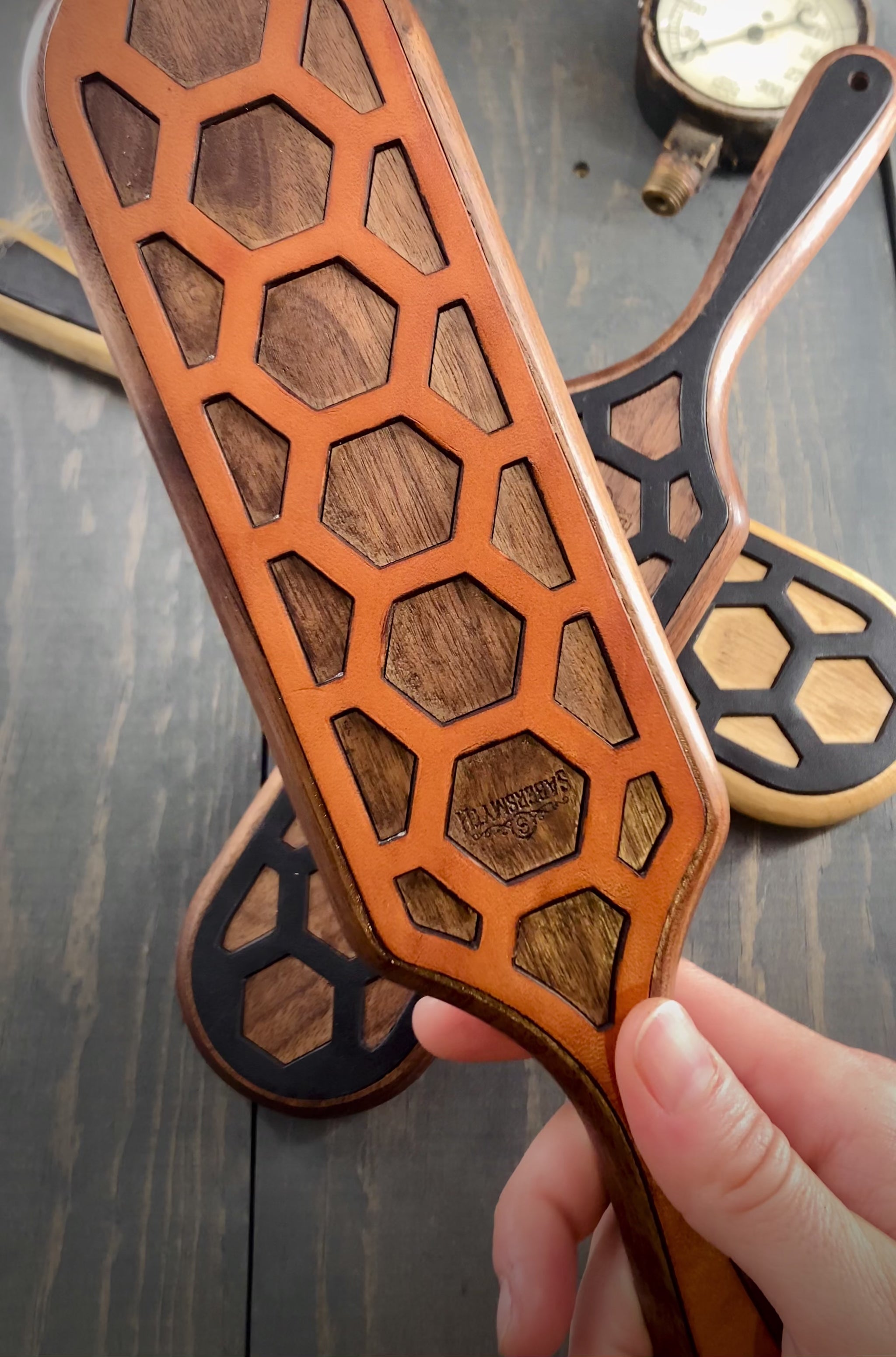 A short video showing the front and back of the oak spanking paddle with leather inlay.