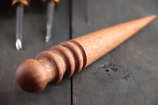 a tool for finishing leather is pictured. This tool is used with a DIY leather kit or craft leather to create and finish leather goods.